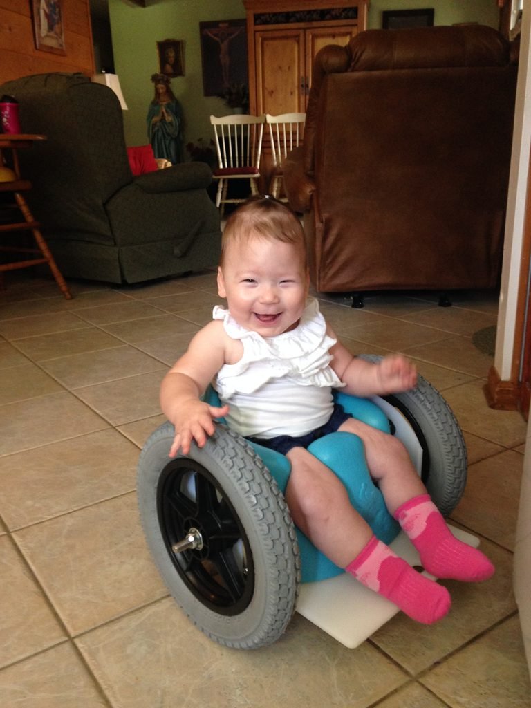 Rosie in her 1st "Bumbo" Wheelchair!